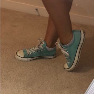 Teal blue converse.